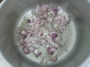 frying onions - memoni akni beef pulao